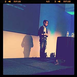 Image: photo of Simon Pascal Klein presenting on web typography at Web Direction South, 2010